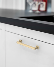 3818-brushed-brass-cabinet-handles-on-White-Kitchen-Cabinets