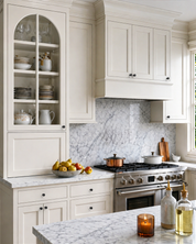 DESIGN4592 Stepped Knobs | Sage Green & White Shaker Cabinets (Champagne Bronze)