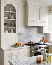 DESIGN4592 Stepped Knobs | Sage Green & White Shaker Cabinets (Champagne Bronze)